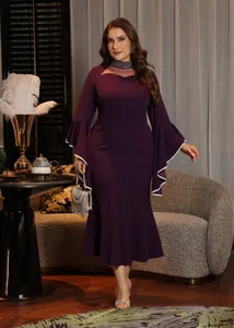 Close-up detail of mesh neckline with rhinestone accents on a purple plus size dress