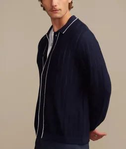 Side view of navy blue knitted Polo cardigan with white piping and perforated texture