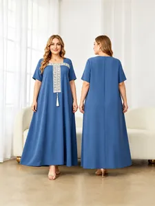 Detail showing the front and back of blue plus-size maxi dress with white embroidery