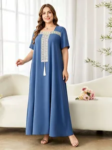 Full-length view of blue plus-size robe with lace embroidery and tassel detail.