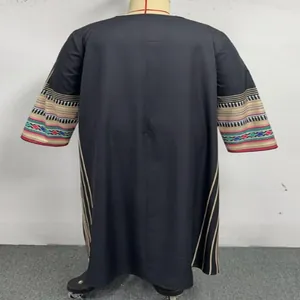 Back view of a plus size ethnic kaftan dress featuring colorful embroidered sleeve details