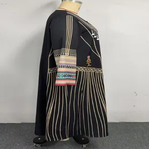 Side profile of a black plus-size ethnic maxi dress with detailed geometric prints