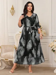 Full length view of elegant plus size black and grey floral mesh V-neck midi dress