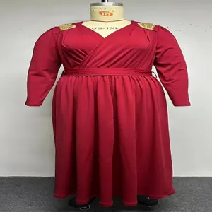 Detailed view of plus size red V-neck maxi dress with gold shoulder accents