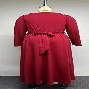 Back view detail of a plus-size red long-sleeved dress featuring a tied waist