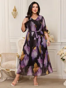 Detailed view of a plus-size V-neck mesh midi dress featuring elegant purple floral prints