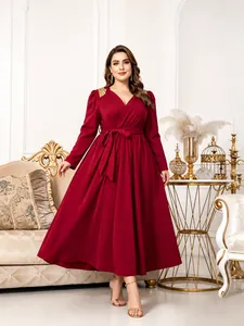 Elegant red plus size V-neck maxi dress with long sleeves and gold shoulder detail