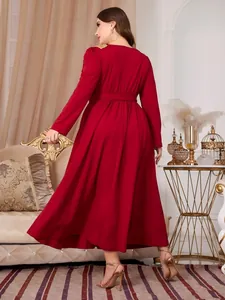 Elegant plus size red long-sleeved maxi dress featuring a waist tie and back view silhouette.