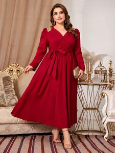 Elegant plus size red V-neck long sleeve maxi dress featuring a waist tie detail.