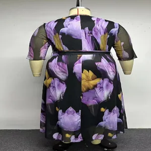 Back view of plus size floral mesh dress with waist belt and elegant purple flower print.