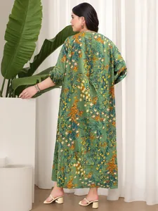 Back view of a plus-size vintage green floral print maxi dress for casual holidays