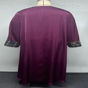 Detailed back view of a purple plus size vintage robe featuring ethnic embroidered cuffs