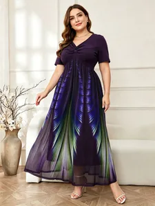 Macro view of the gradient feather print and mesh skirt on the plus-size maxi dress