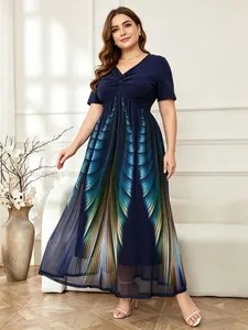 Close-up showing the elegant gradient feather print and mesh detail of this navy dress