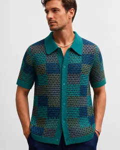 Detailed view of men's crochet checkered knit polo shirt featuring hollow-out pattern