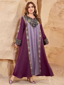 Plus size purple kaftan dress with intricate ethnic embroidery and patchwork design