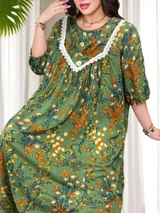 Detail view of retro floral print plus size maxi dress with lace patchwork.