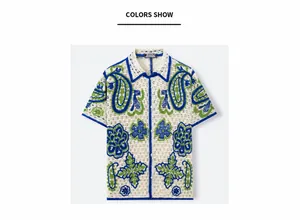 Detailed view of white Hawaiian knit cardigan with blue paisley hollow jacquard