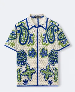 Full front view of men's Hawaiian hollow knit polo shirt with paisley floral embroidery