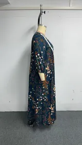 Side view of a plus size vintage floral maxi dress with lantern sleeves and lace trim