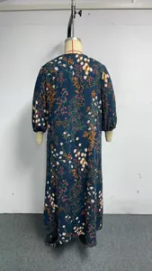 Detailed back view of a vintage dark blue floral print maxi dress with long lantern sleeves