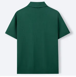 Back view of premium dark green short sleeve knitted Polo shirt featuring ribbed hem detail