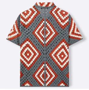 Detail of short-sleeved crochet knit polo shirt with red and white diamond pattern