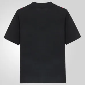 Back view of a black men's knit polo shirt with subtle red shoulder stripes