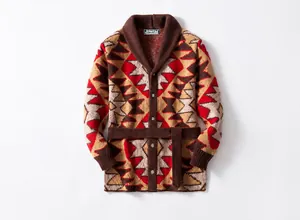 Detail view of a heavy knit geometric jacquard cardigan in brown with shawl collar