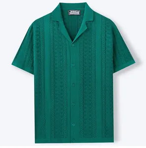 Detailed view of dark green short-sleeved knit shirt with Cuban collar and wheat-ear pattern