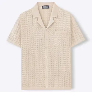 Close-up of beige knit shirt featuring a Cuban collar and heart jacquard pattern
