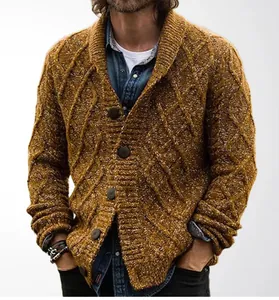 Detail of ginger cable-knit cardigan showing variegated yarn texture and buttons