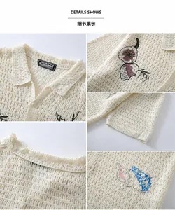 Detailed close-up of men's cream crochet knit polo shirt with embroidered accents
