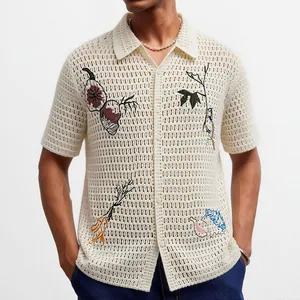 Men's cream crochet knit shirt with floral embroidery and open collar vacation style.