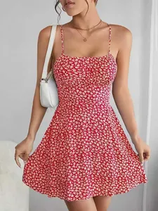 Detail of a red floral print backless sundress with slim fit and spaghetti straps.