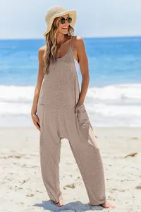 Casual loose tan jumpsuit for women featuring large pockets and a sunny beach style vibe.