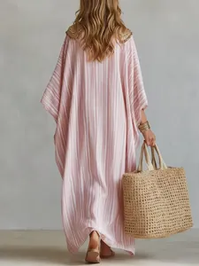 Detail view of the back of a pink striped maxi kaftan dress with beaded shoulders