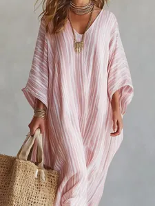 Detailed view of a bohemian pink striped V-neck kaftan maxi dress with wide sleeves.