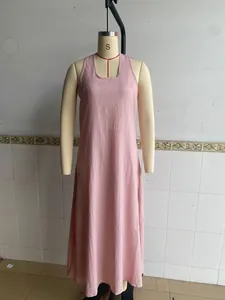 Detailed view of pink crinkle textured fabric on sleeveless maxi beach dress