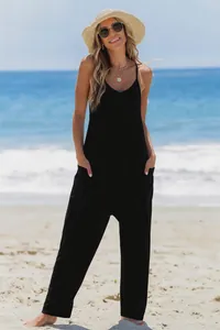 Detail shot of a stylish black summer camisole jumpsuit featuring functional side pockets.