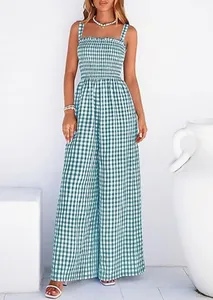 Detailed macro view of green gingham pattern and smocked bodice on wide-leg jumpsuit