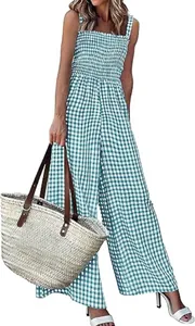 Detailed view of blue gingham wide-leg jumpsuit with smocked bodice for summer.