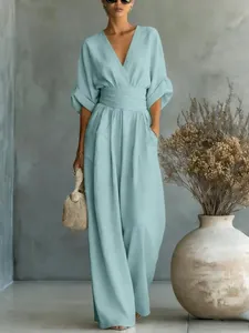 Elegant light blue V-neck jumpsuit with cinched waist and wide leg design for women