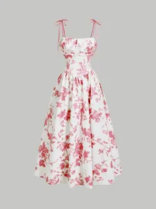 Vestido midi floral elegante con tirantes de lazo ajustables y cintura entallada.