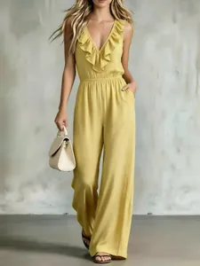 Elegant yellow v-neck sleeveless jumpsuit with ruffled details and wide leg pants