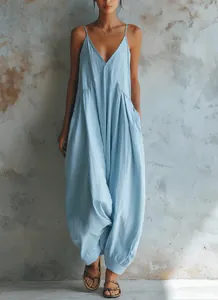Elegant light blue French style deep V-neck strappy jumpsuit with loose harem pants