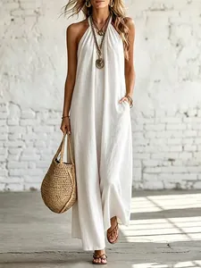 White linen halter maxi dress with backless design and pockets for summer vacation