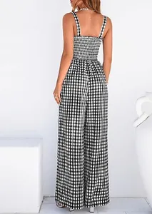 Detailed back view of a black and white gingham smocked wide-leg jumpsuit with thin straps.