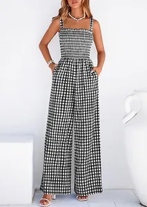 Chic black and white gingham wide-leg jumpsuit with smocked bodice and thin straps.