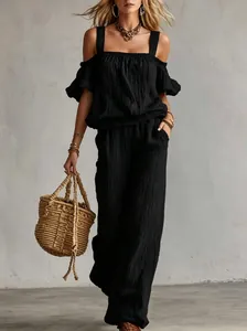 Detailed look at the textured off-shoulder top and wide-leg pants summer set in black.